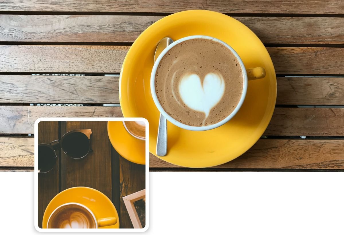 A cup of coffee with a heart in the foam on a yellow saucer, on a wooden table, with a small framed photo of another coffee cup